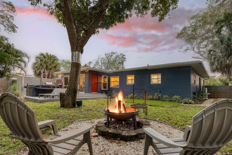 fire pit by the house backyard with chairs making this home as a fort lauderdale airbnb spring home