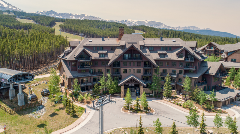 big brown mansion with lots of windowns and near a cable car making it as one of the best Breckenridge airbnb